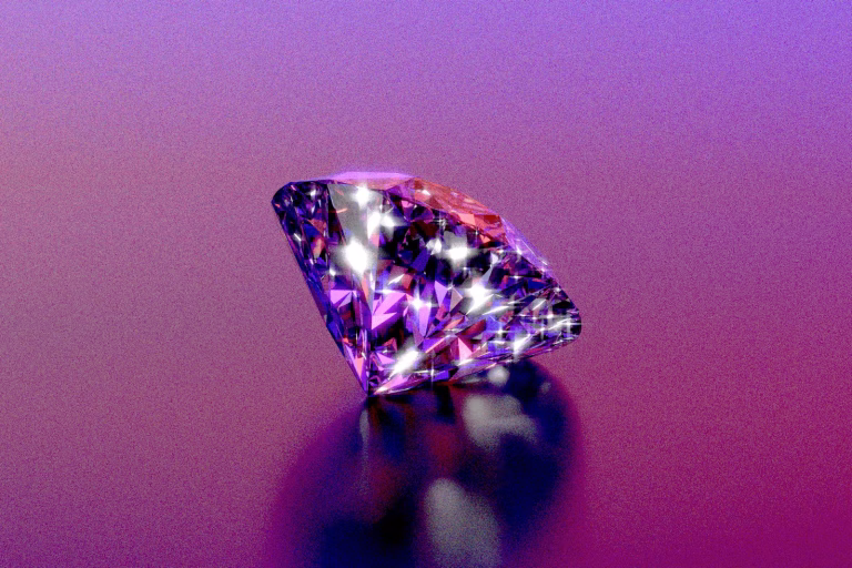 A sparkly diamond shines on a purple background.