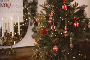 A decorated christmas tree with warm lights and ornaments.
